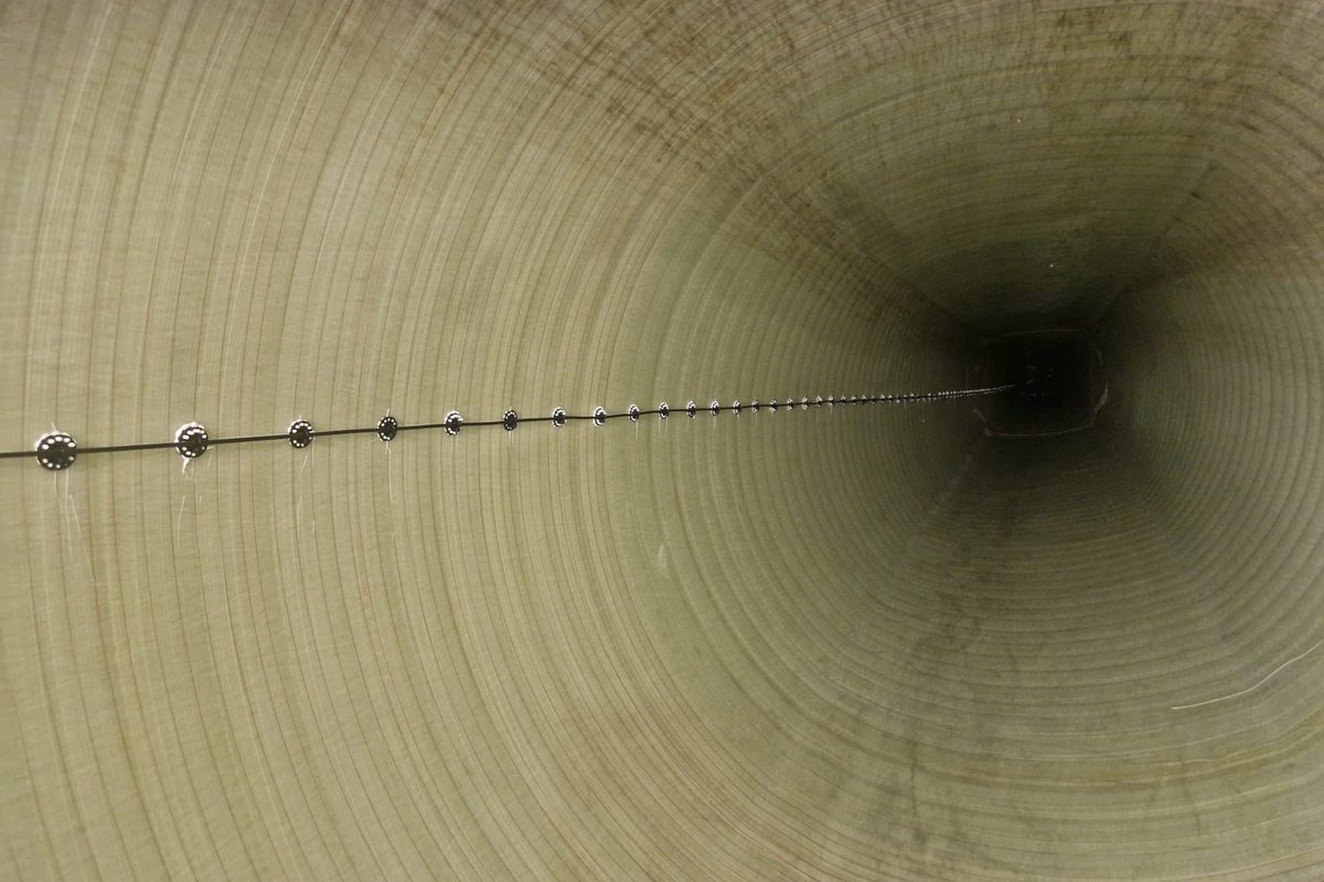 Fibre optic sensing line installed inside a wind turbine blade